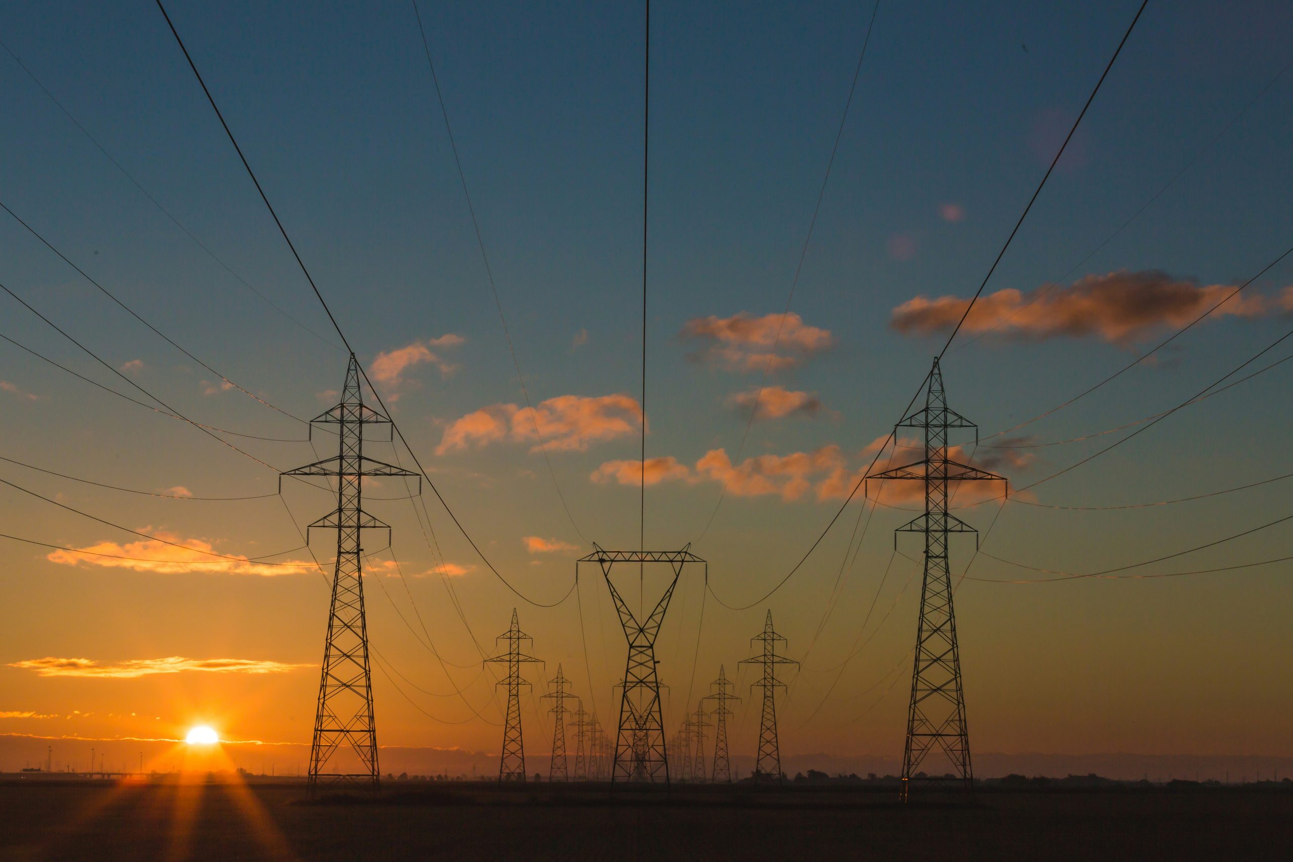 A set of power lines in the sunset